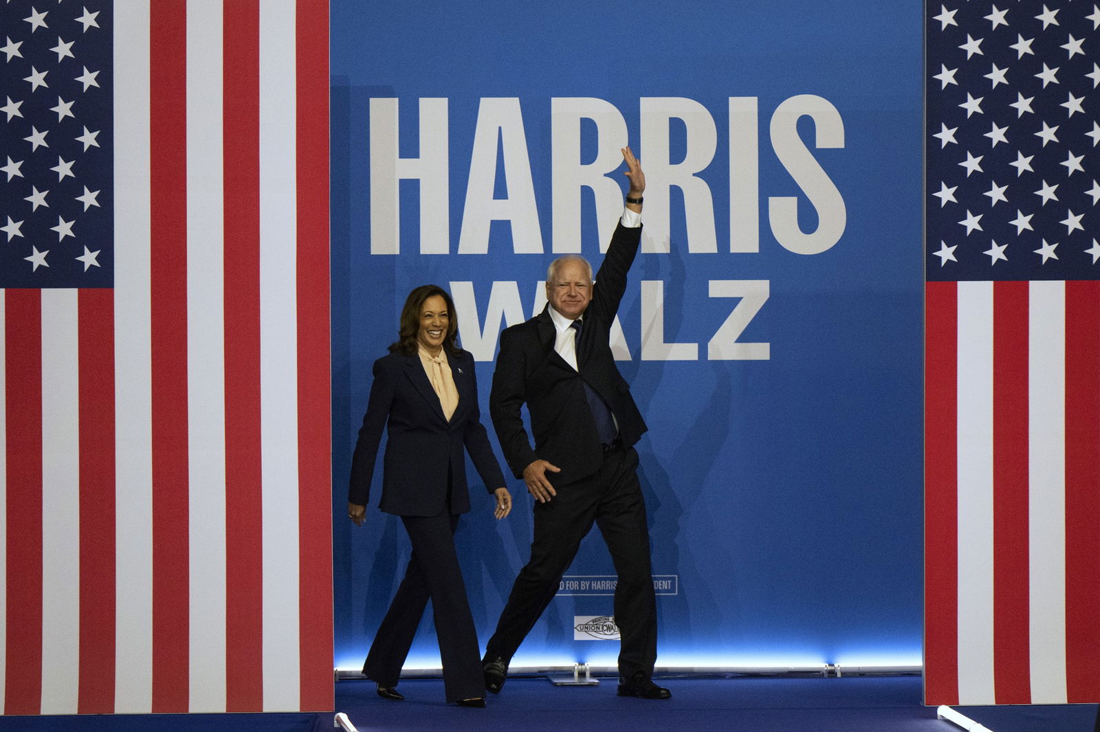 Kamala Harris and Tim Walz walk out.