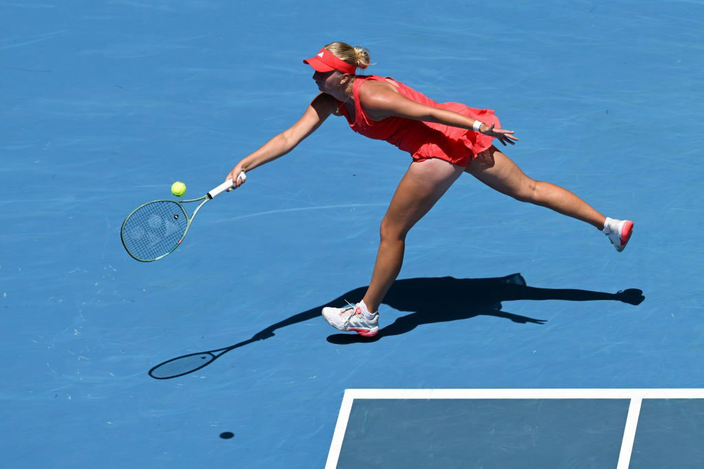 Clara Tauson stretches for a forehand at the Australian Open.