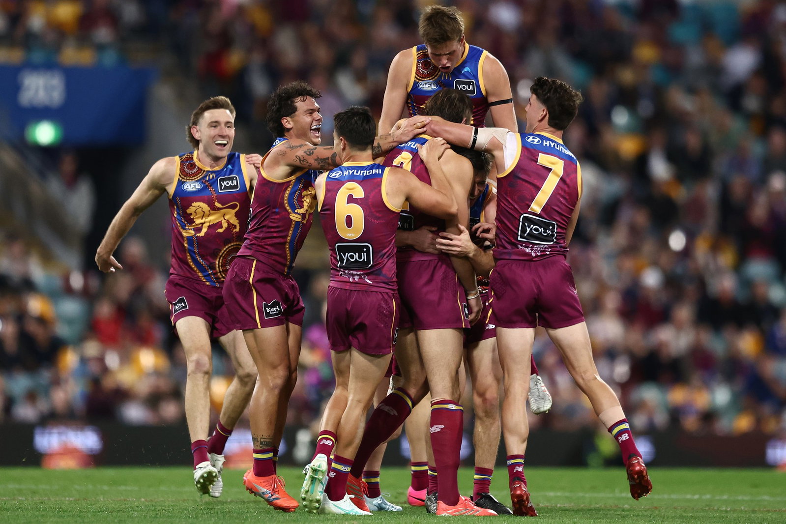 Sam Draper of the Lions celebrates a goal during the round 18 AFL match between Brisbane Lions and Essendon Bombers at The Gabba, on July 12, 2026, in Brisbane, Australia.