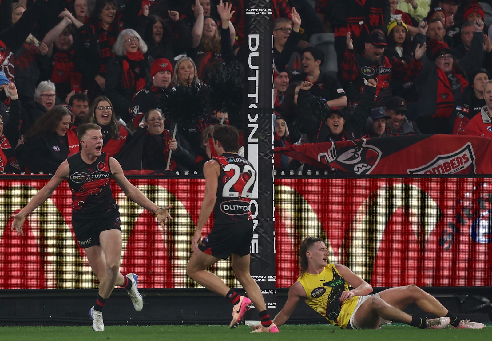 Angus Clarke of the Bombers celebrates a goal during the 2025 AFL Round 11 match between the Essendon Bombers and the Richmond Tigers at the Melbourne Cricket Ground on May 23, 2025 in Melbourne, Australia.