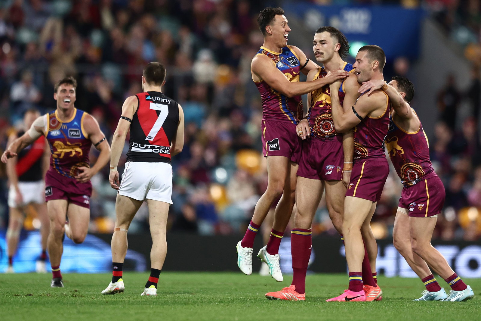 Sam Draper of the Lions celebrates a goal during the round 18 AFL match between Brisbane Lions and Essendon Bombers at The Gabba, on July 12, 2026, in Brisbane, Australia.
