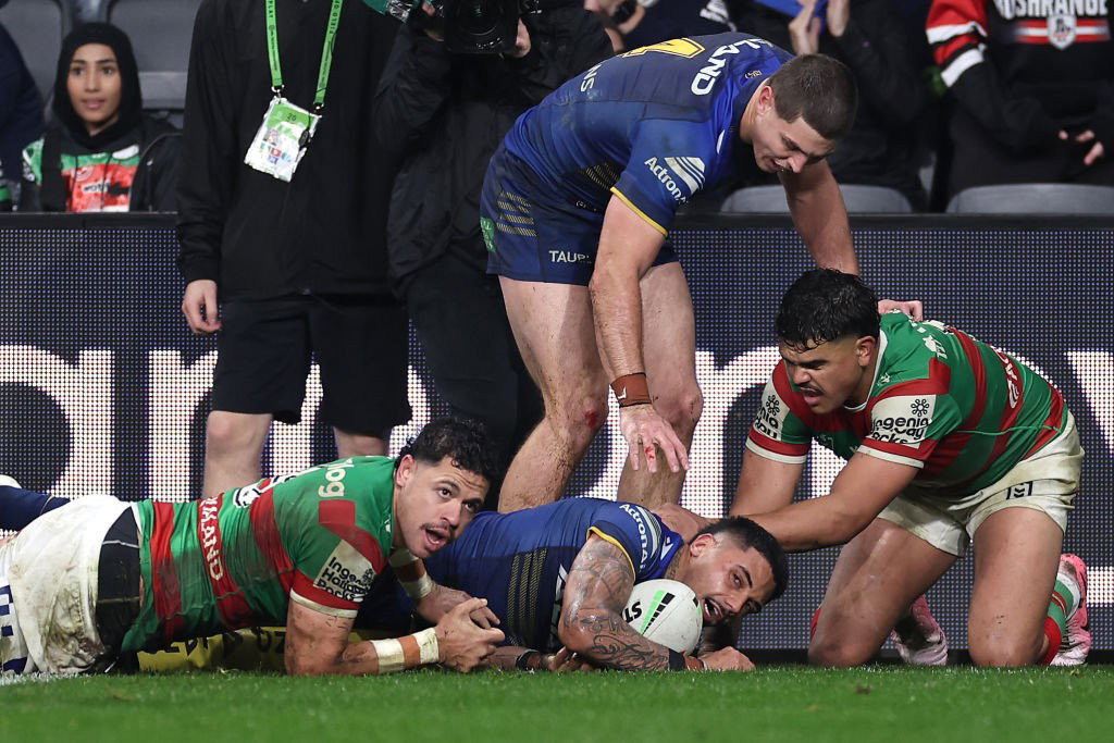 Jake Tago looks up after being tackled by South Sydney Rabbitohs.