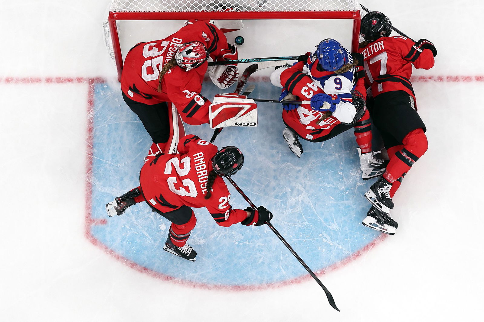Kirsten Simms #9 of Team United States scores a goal past Ann-Renee Desbiens #35 of Team Canada in the second period during the Women's Preliminary Group A match between United States and Canada on day four of the Milano Cortina 2026 Winter Olympic games at Milano Santa Giulia Ice Hockey Arena on February 10, 2026 in Milan, Italy. 