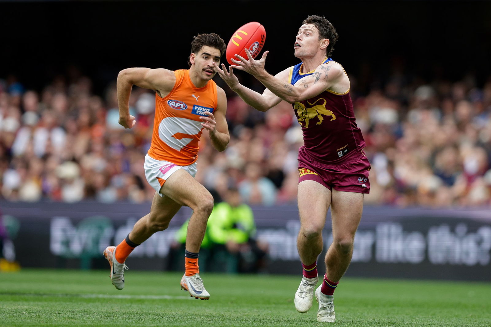 Giants tagger Toby Bedford chases Brisbane star Lachie Neale in Round 22 this year.