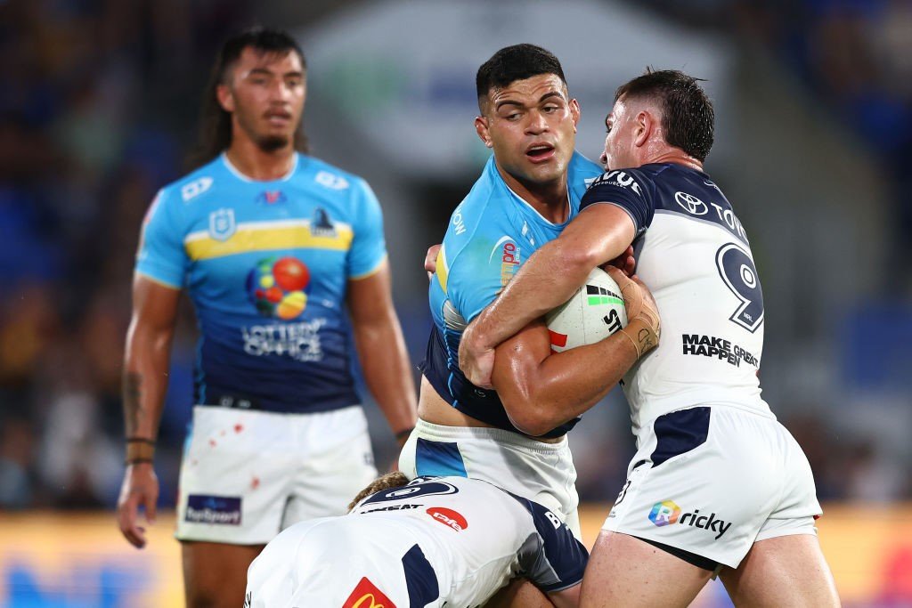 David Fifita is tackled by Cowboys players during an NRL game.