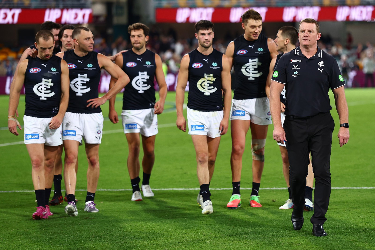 Michael Voss, Senior Coach of the Blues and the team leave the field after the round nine AFL match between Brisbane Lions and Carlton Blues at The Gabba, on May 08, 2026, in Brisbane, Australia.