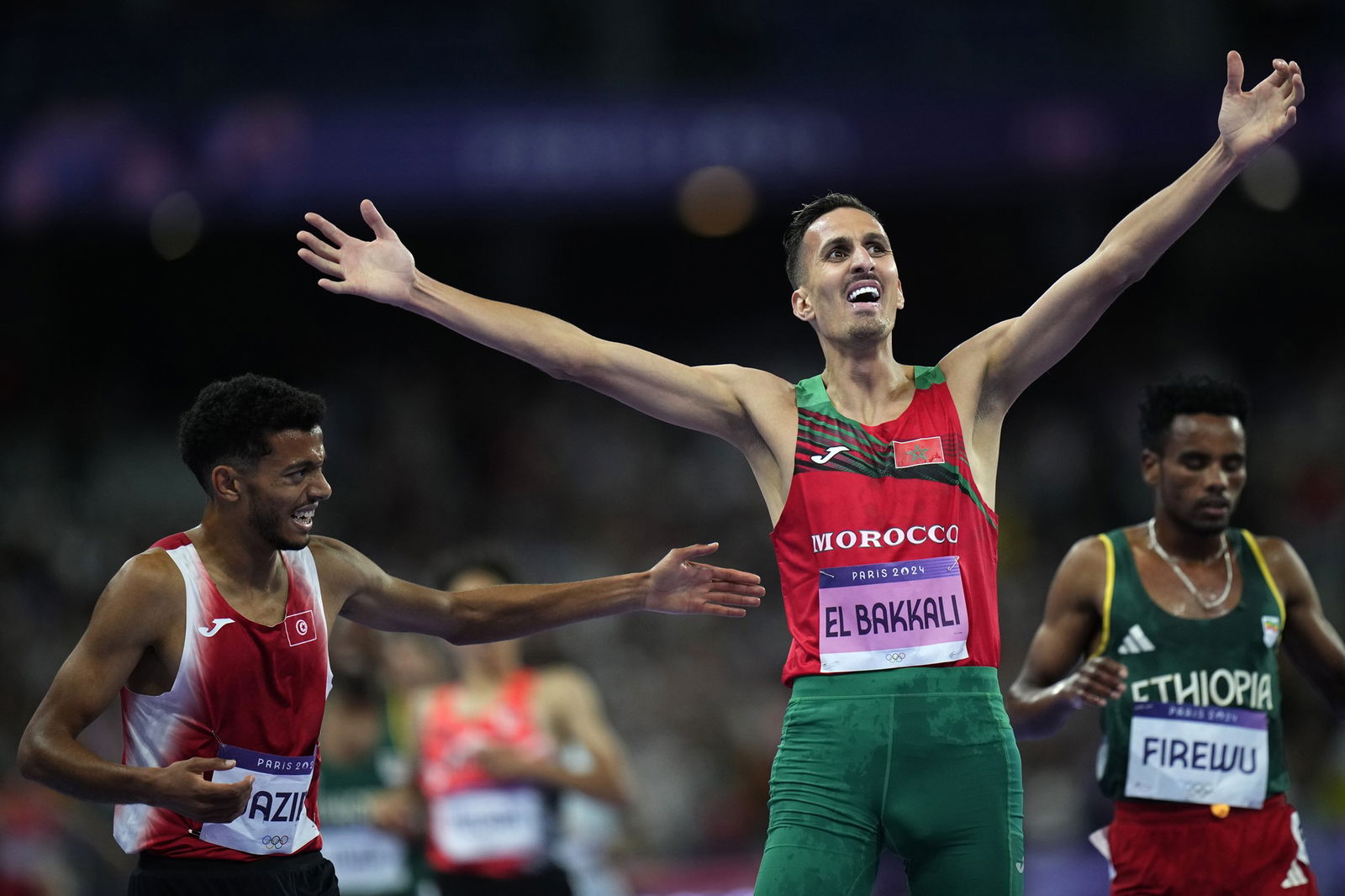 Morocco's Soufiane El Bakkali reacts as he crosses the line to win the men's 3000m steeplechase. 