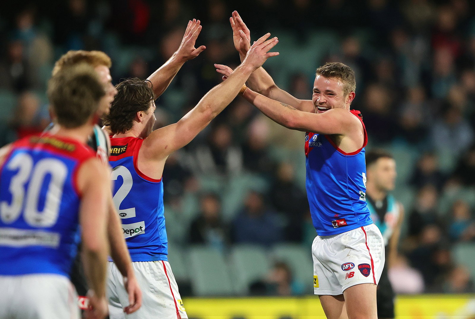 Kade Chandler (right) kicked four goals in Melbourne's 76-point win over Port Adelaide.