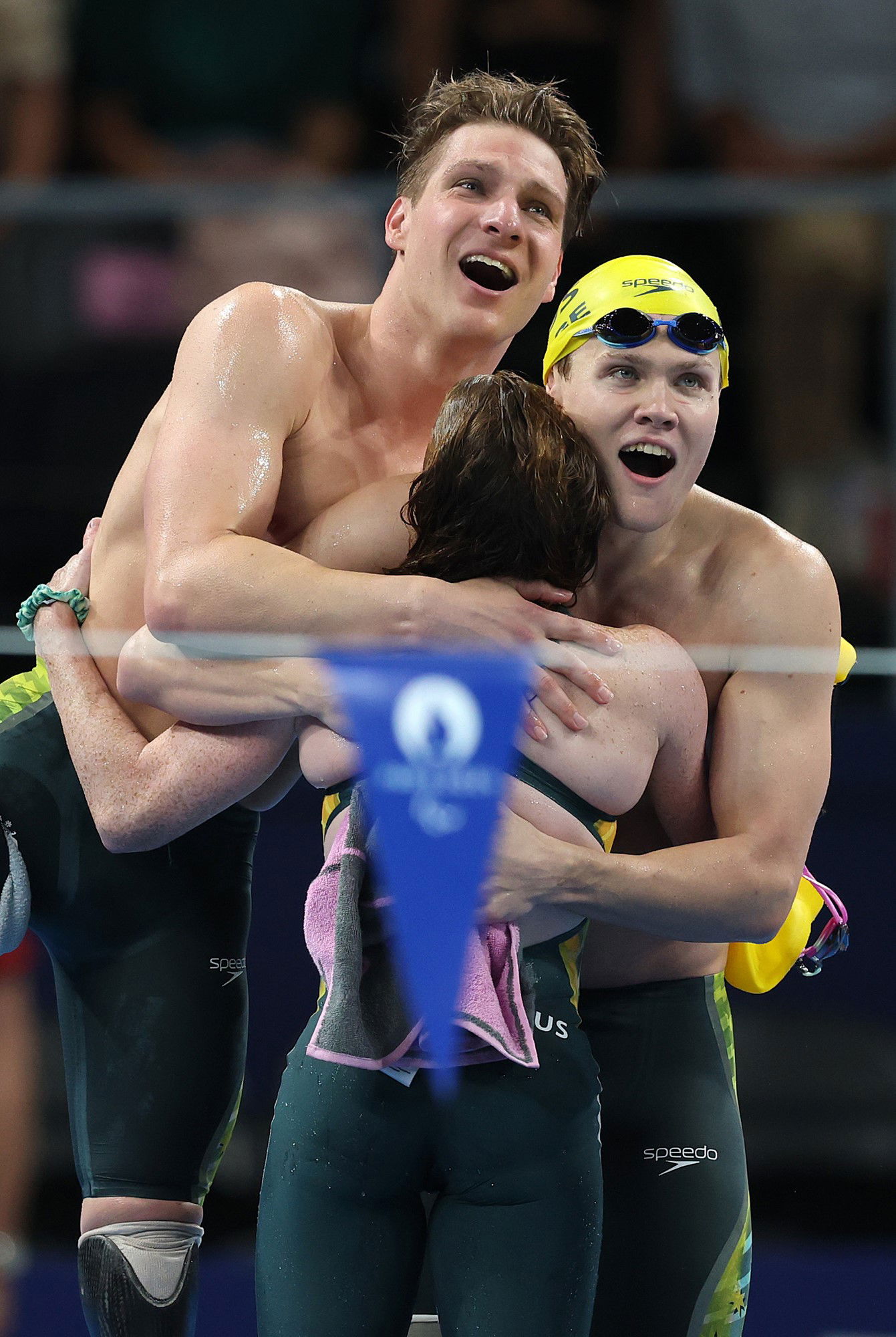 Jesse Aungles, Timothy Hodge and Emily Beecroft of Team Australia react after the Mixed 4x100m Medley Relay - 34 Points in Paris.