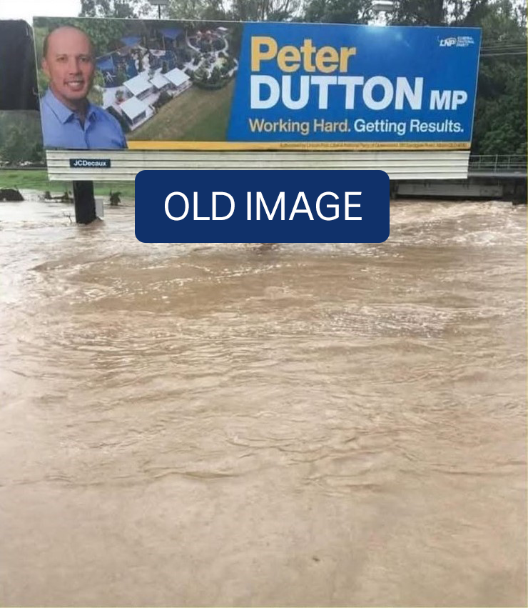 A billboard for Peter Dutton surrounded by brown floodwater.