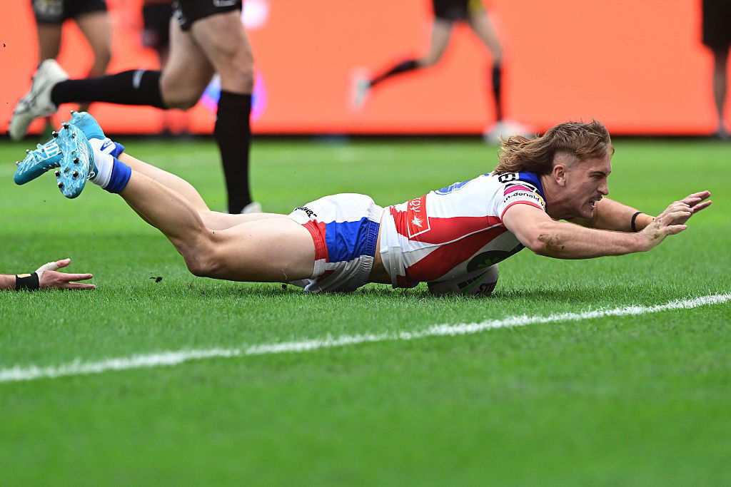 Fletcher Sharpe dives on the ball.