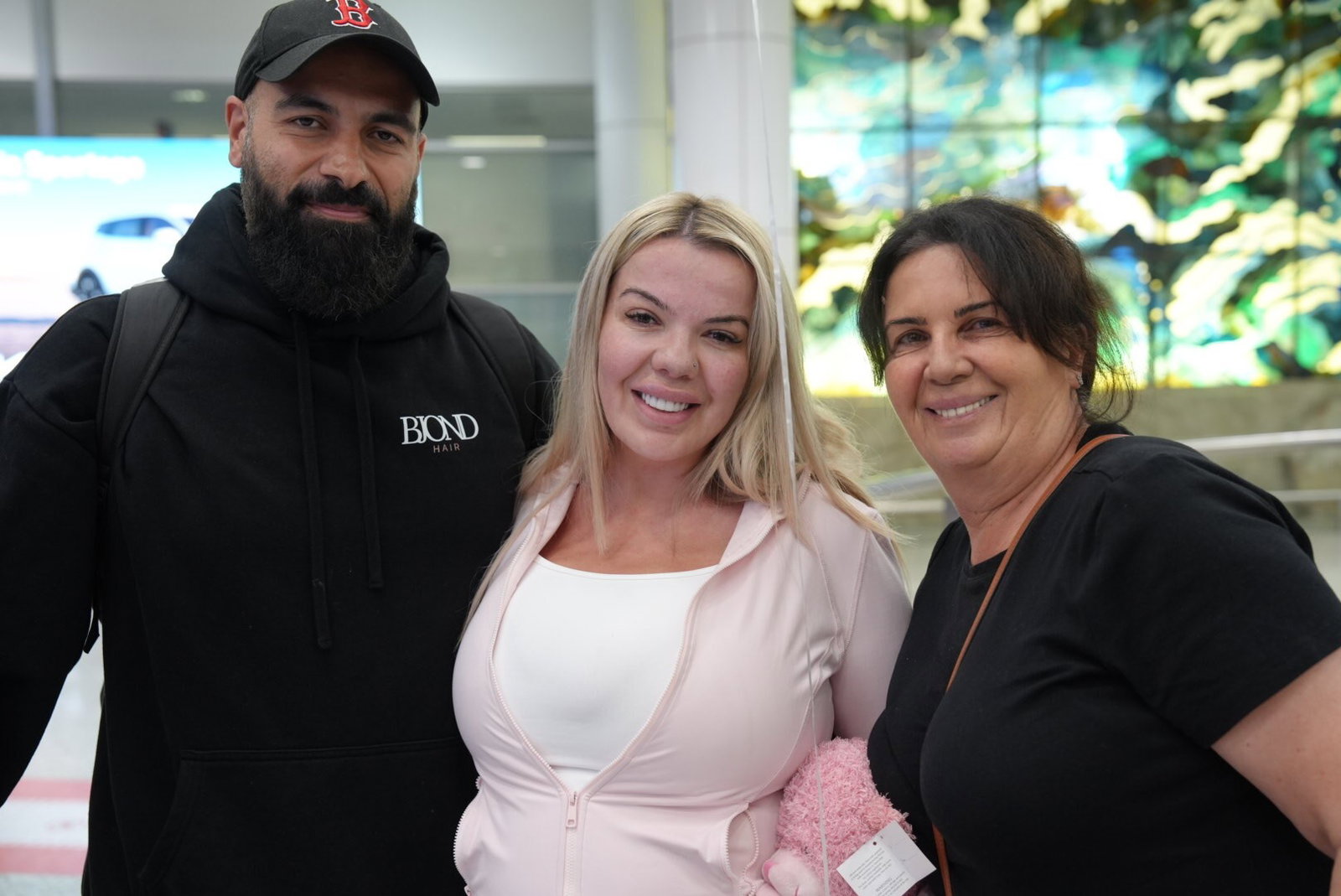 Dina Iseani (centre) with her husband and mother