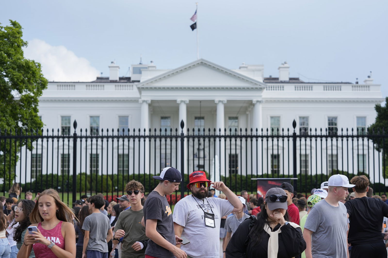 A crowd outside the white house. 