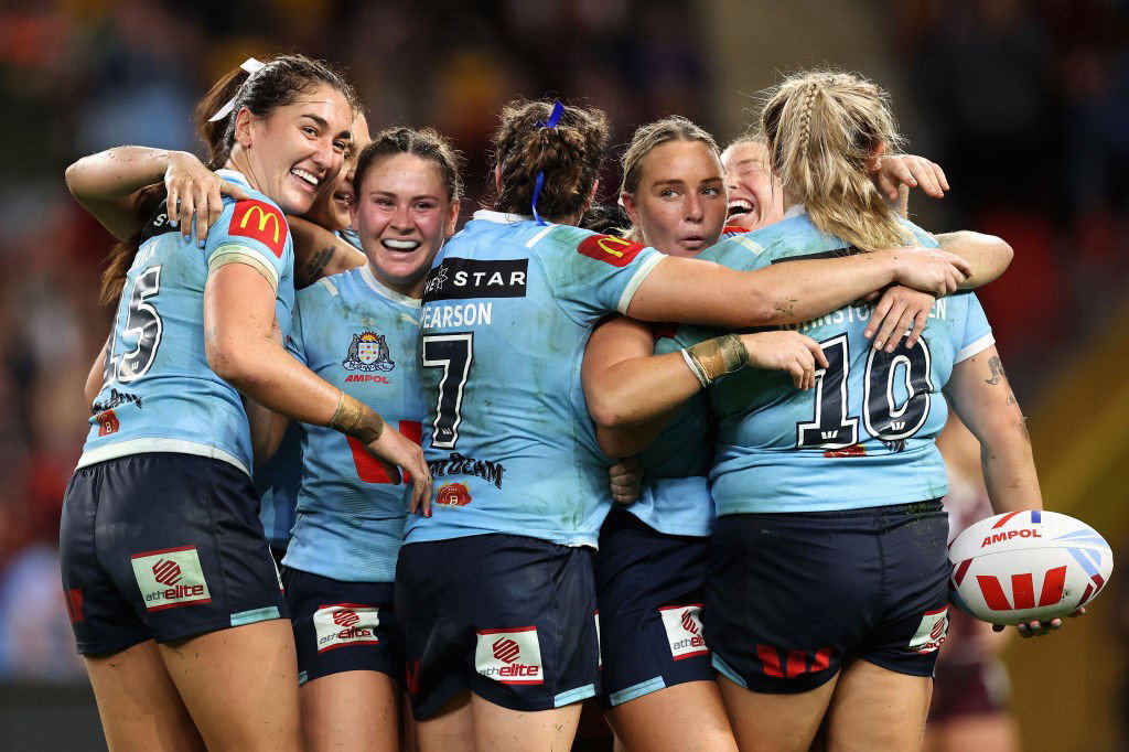 NSW Sky Blues players hug during the Women's State of Origin.