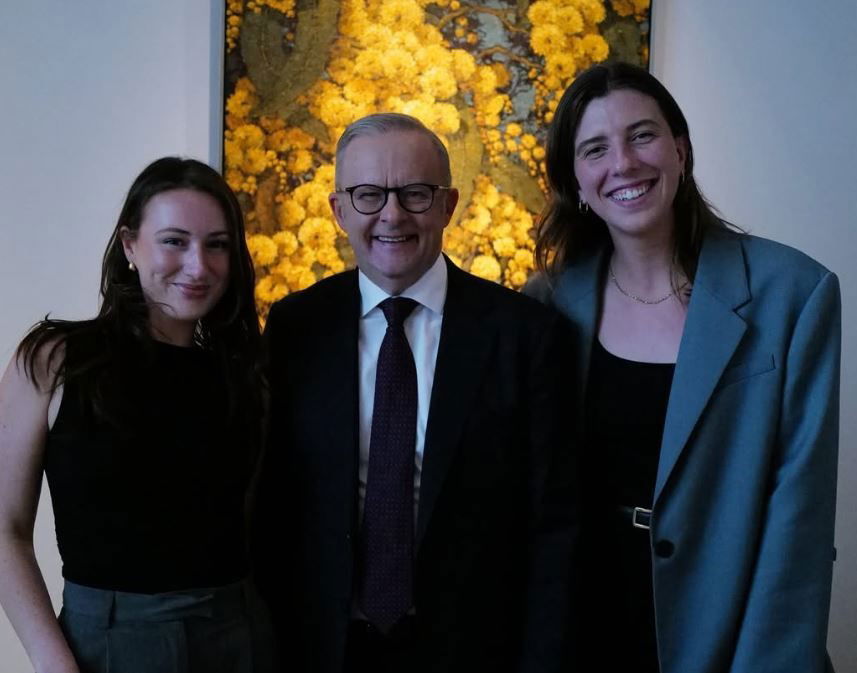 Anthony Albanese smiling while standing nex to Hannah Ferguson and Sarah-Jane Adams.