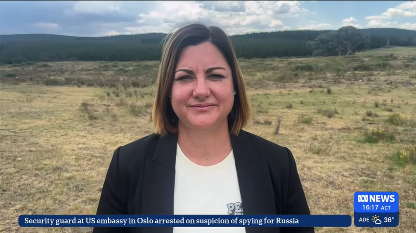 A woman in a field in a screengrab