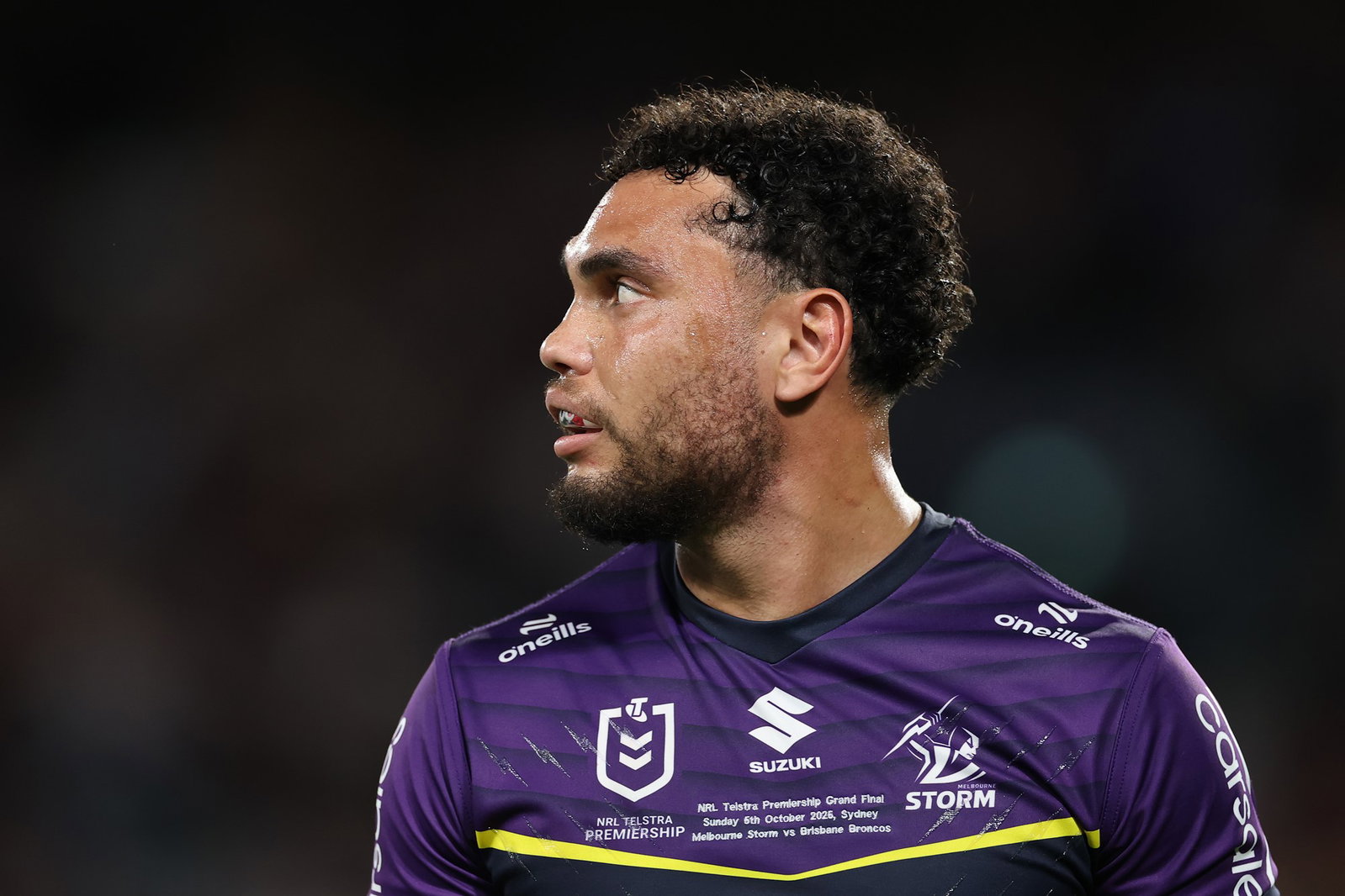 A closeup shot of a rugby league player in purple