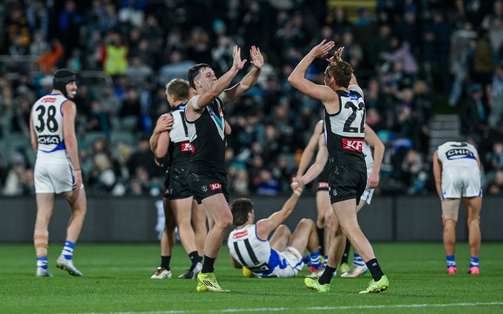 Zak Butters and Logan Evans of the Power celebrate the final siren during the round 17 AFL match between Port Adelaide Power and North Melbourne Kangaroos at Adelaide Oval, on July 05, 2026, in Adelaide, Australia.