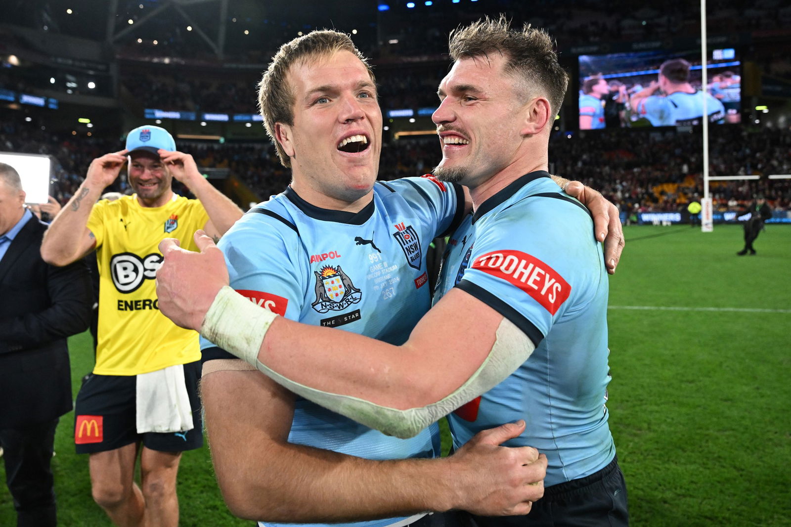 Jake Trbojevic hugs NSW Blues teammate Angus Crichton after State of Origin III.