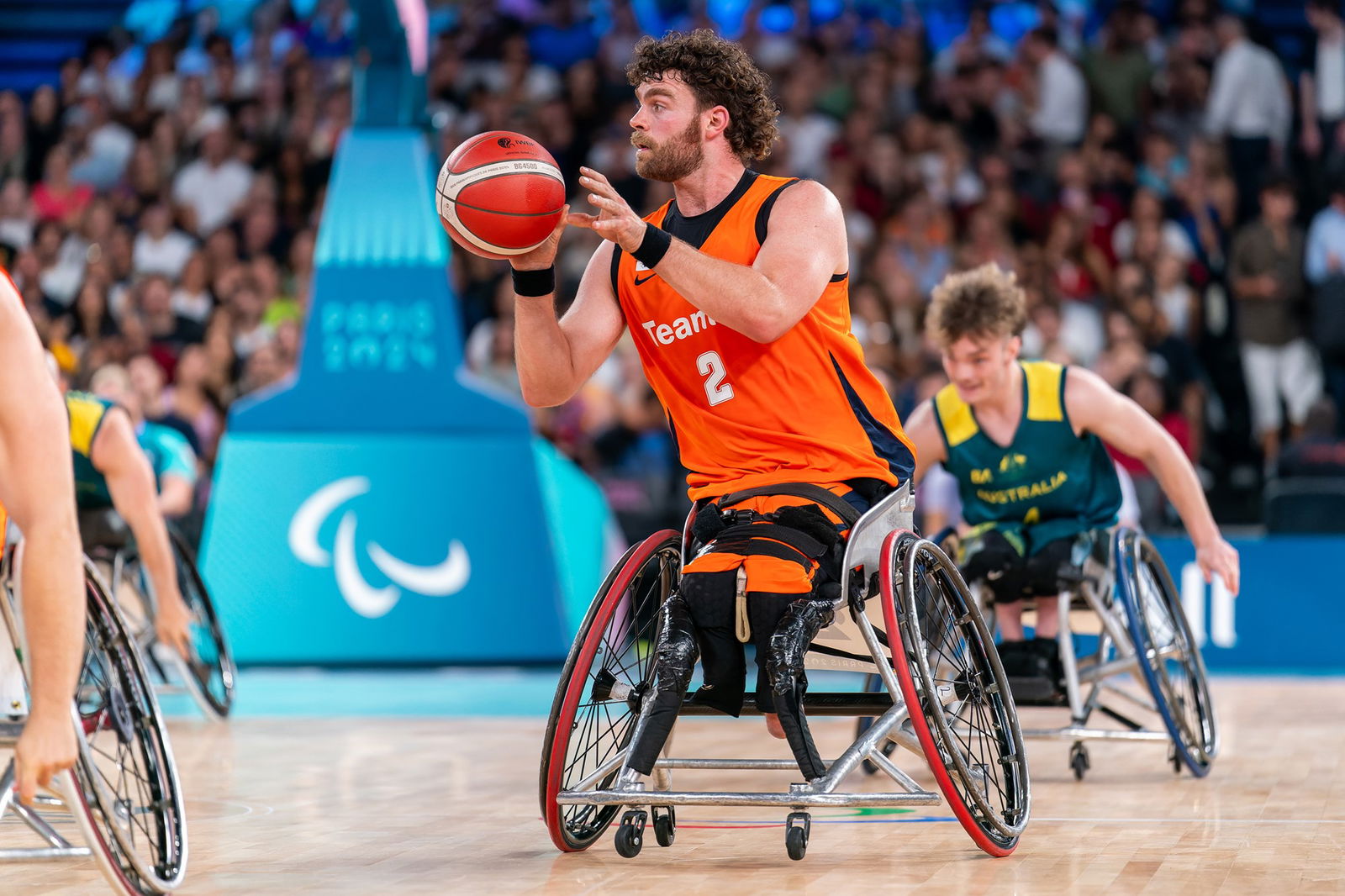 Mendel op den Orth holds the ball for The Netherlands against Australia in wheelchair basketball in Paris.