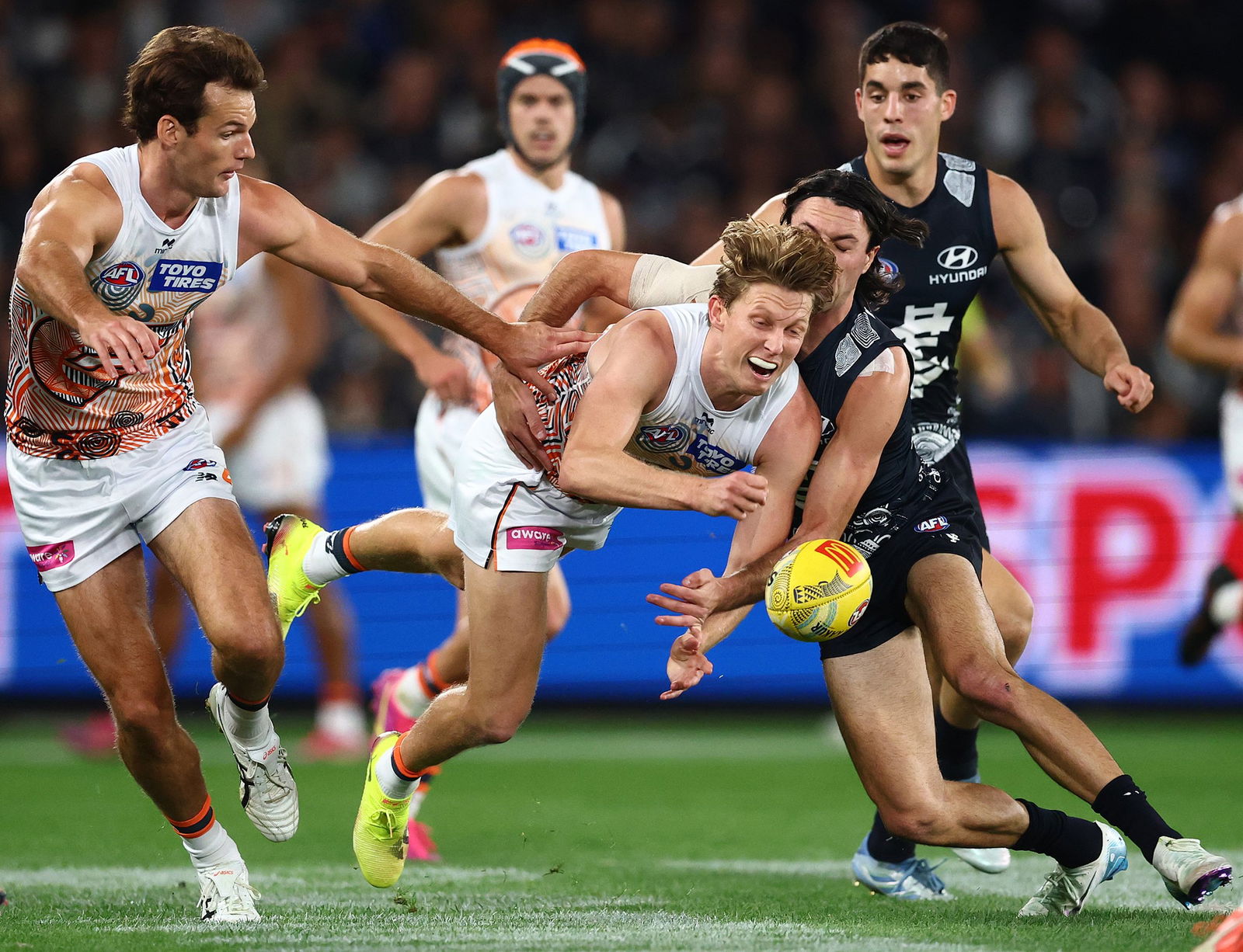 Lachie Whitfield handballs