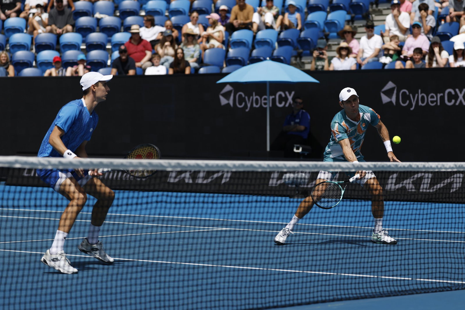 Matthew Ebden plays a volley in the Australian Open doubles.
