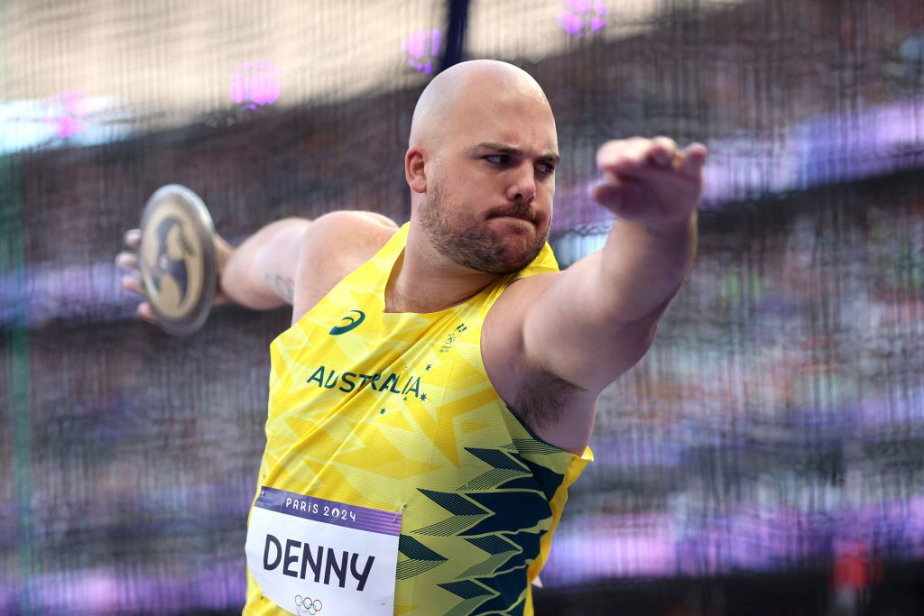 Matt Denny winds up to throw the discus at the Paris Olympics.