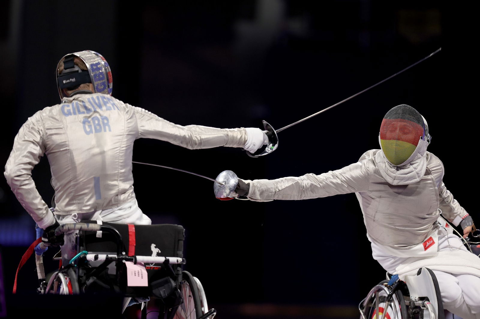 Germany's Maurice Schmidt (R) competes against Great Britain's Piers Gilliver in the men's sabre category A gold medal bout in Paris.