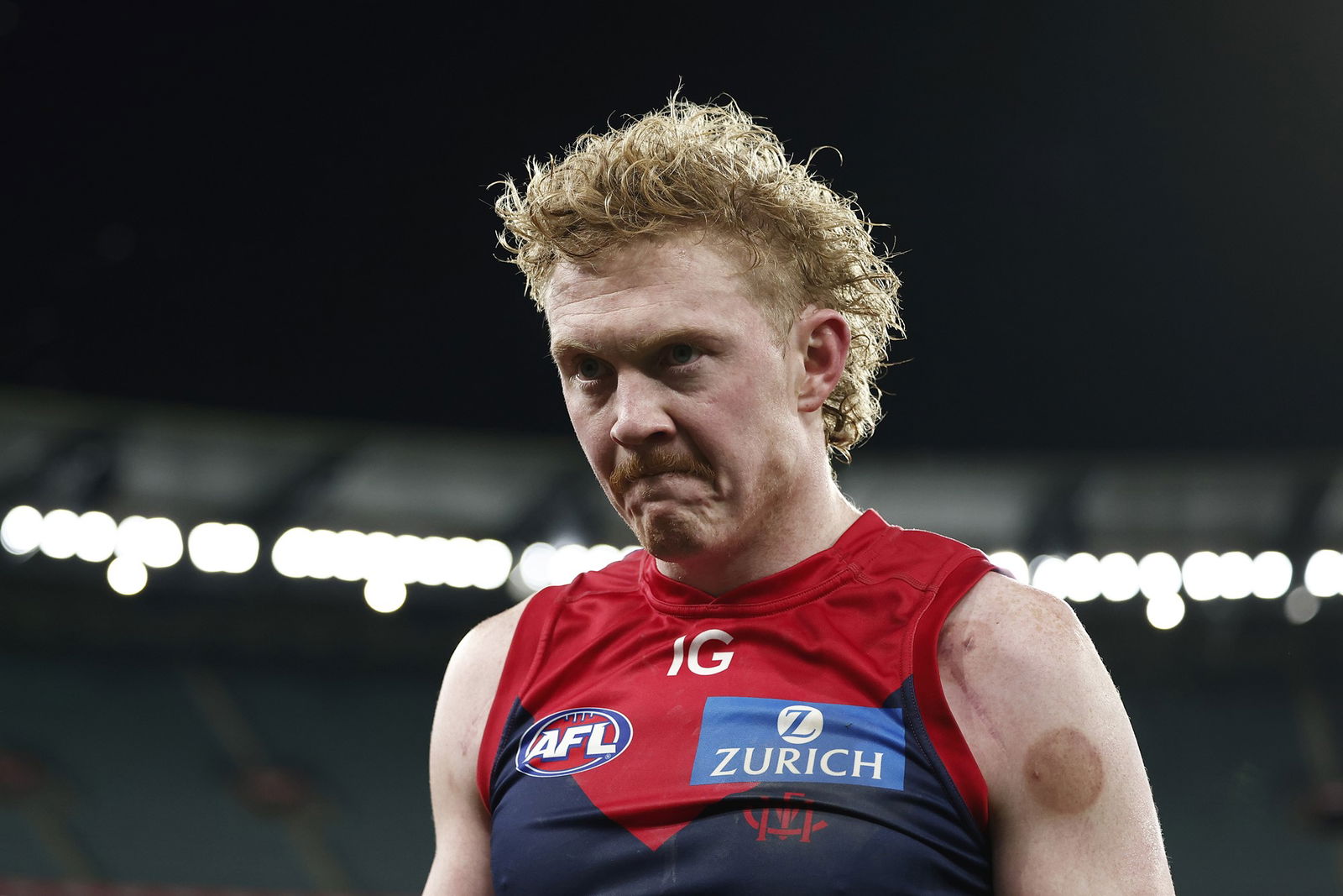 Clayton Oliver walks off the field after Melbourne's loss to the GWS Giants