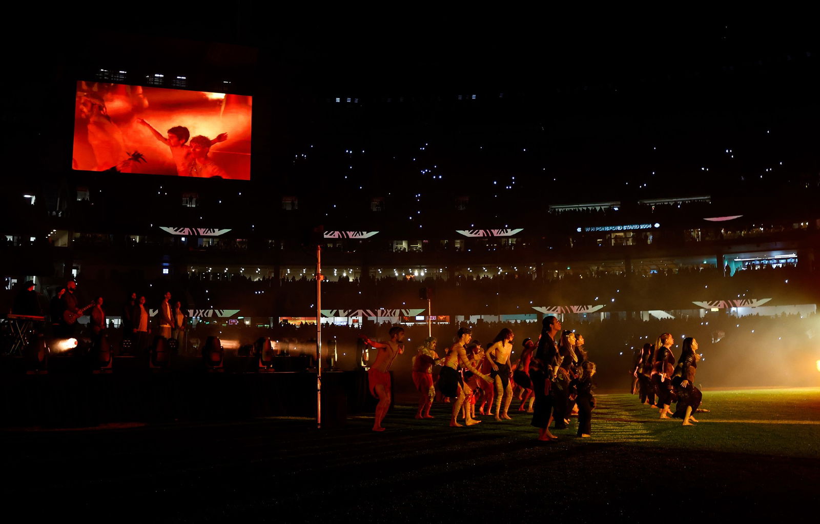 Dancers perform during the 2025 AFL Round 11 match between the Essendon Bombers and the Richmond Tigers at the Melbourne Cricket Ground on May 23, 2025 in Melbourne, Australia.