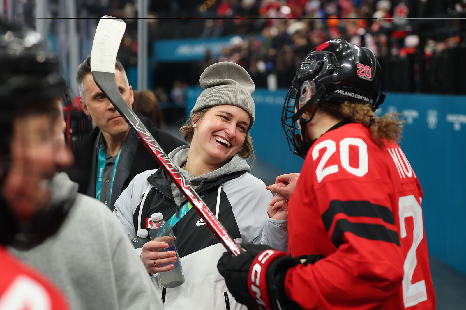 Marie-Philip Poulin #29 of Team Canada greets teammate Sarah Nurse #20 prior to the Women's Preliminary Group A match between United States and Canada on day four of the Milano Cortina 2026 Winter Olympic games at Milano Santa Giulia Ice Hockey Arena on February 10, 2026 in Milan, Italy.