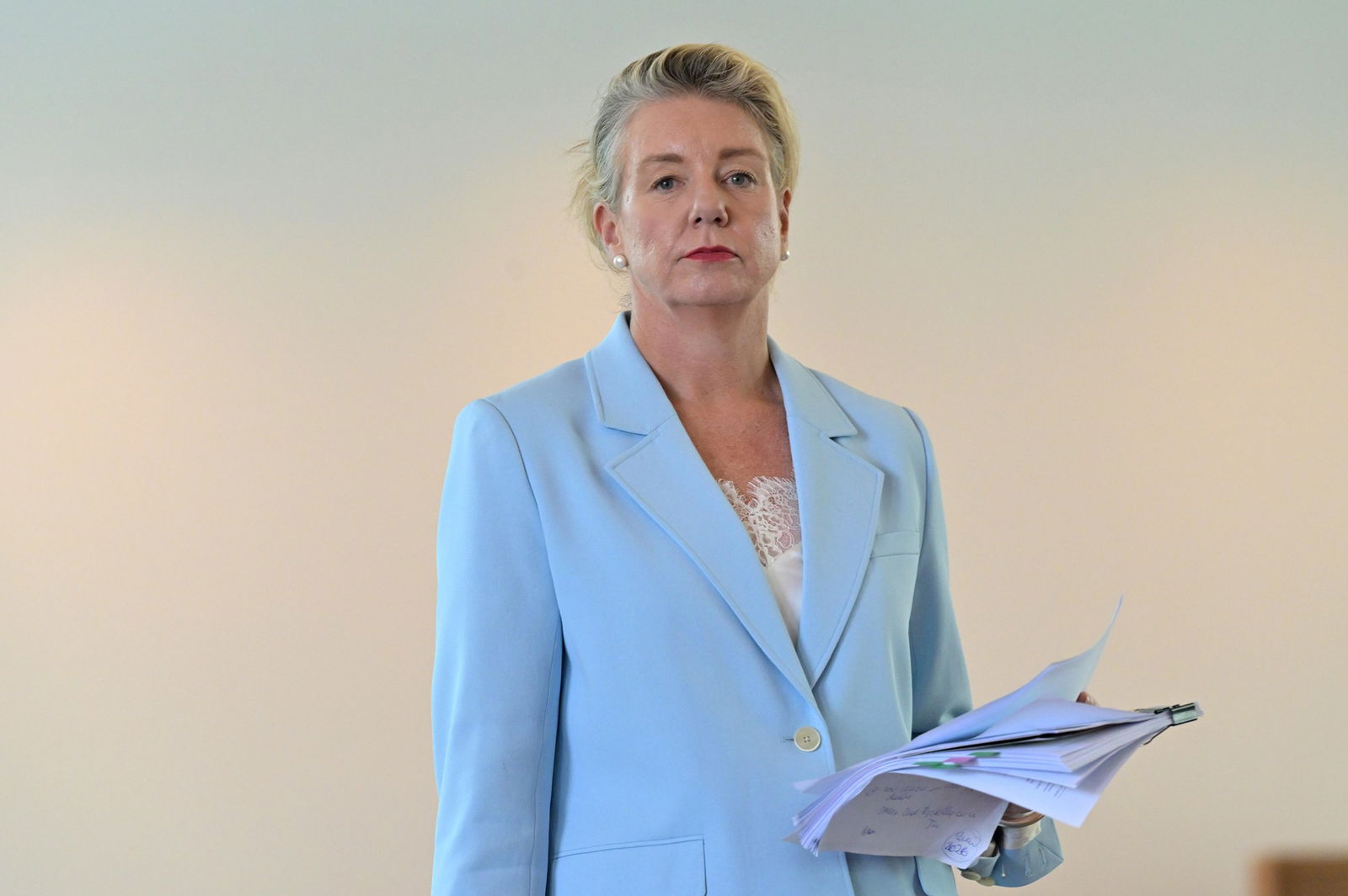woman in a pale blue suit