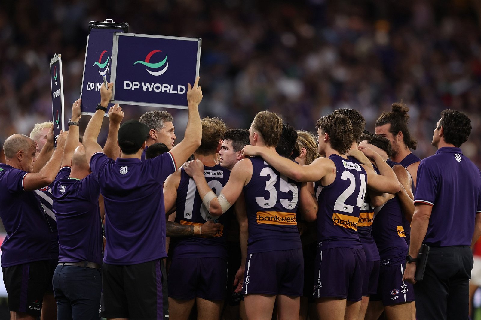 Fremantle players in a huddle