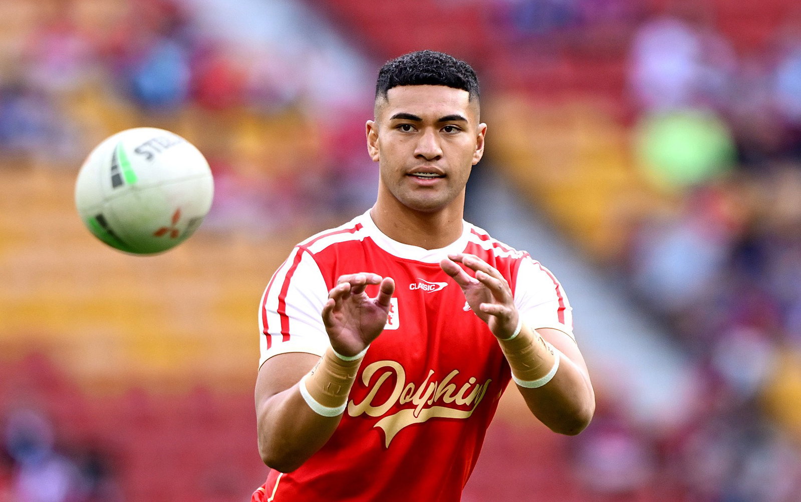 Isaiya Katoa of the Dolphins catches the ball during the warm up before the round 17 NRL match between Dolphins and New Zealand Warriors at Lang Park, on June 27, 2026, in Brisbane, Australia.