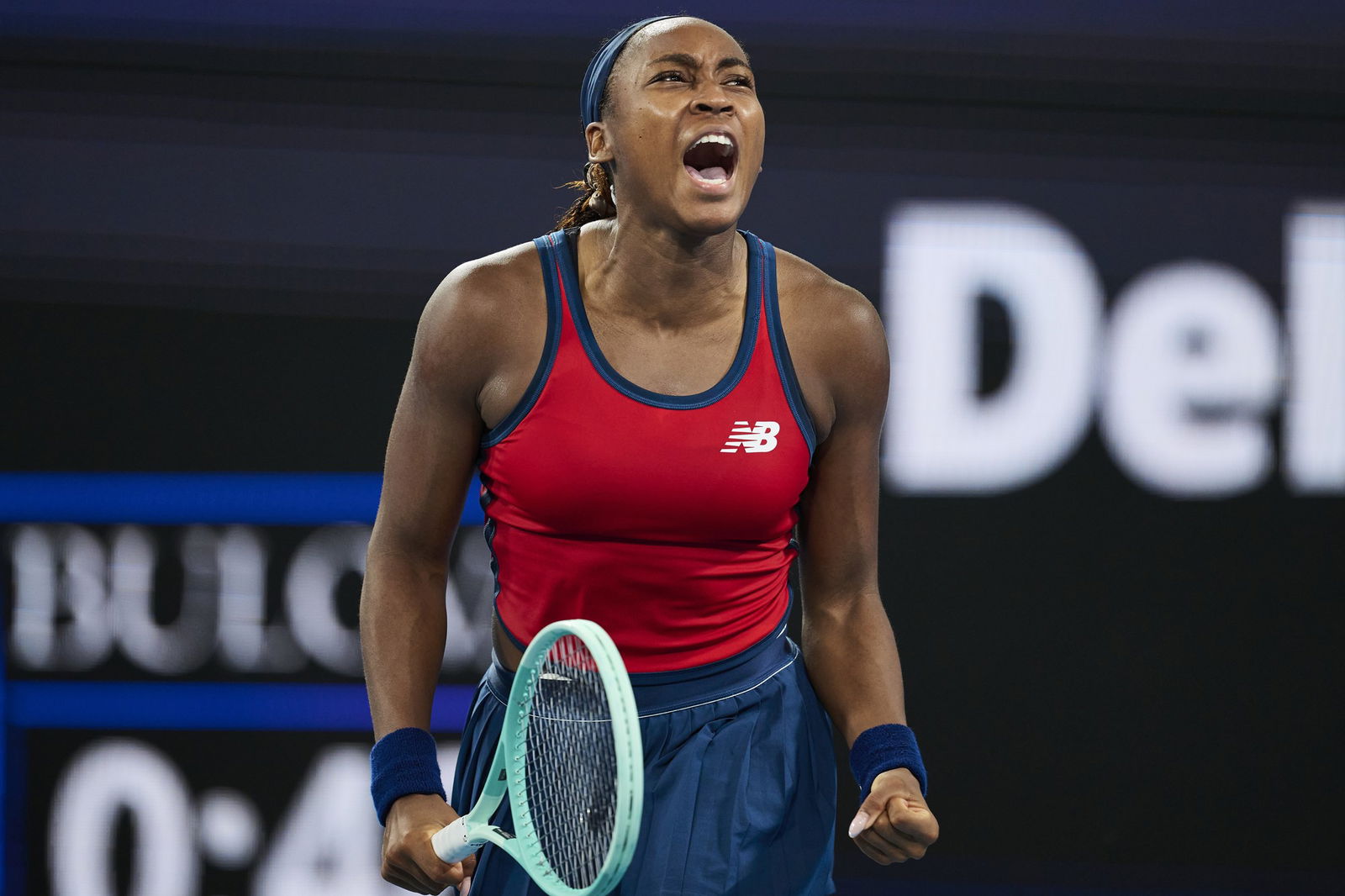 Coco Gauff yells out as she celebrates winning a point.