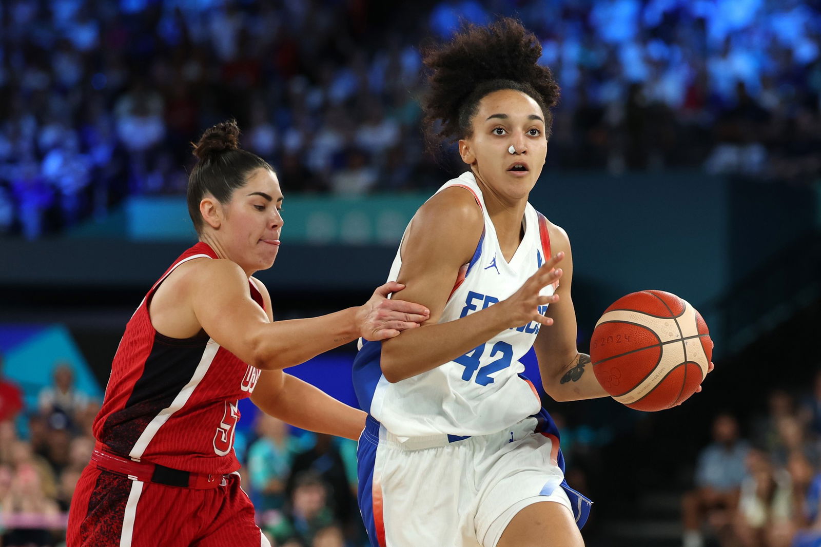 Leila Lacan #42 of Team France drives past Kelsey Plum #5 of Team United States during the Women's Gold Medal game between Team France and Team United States