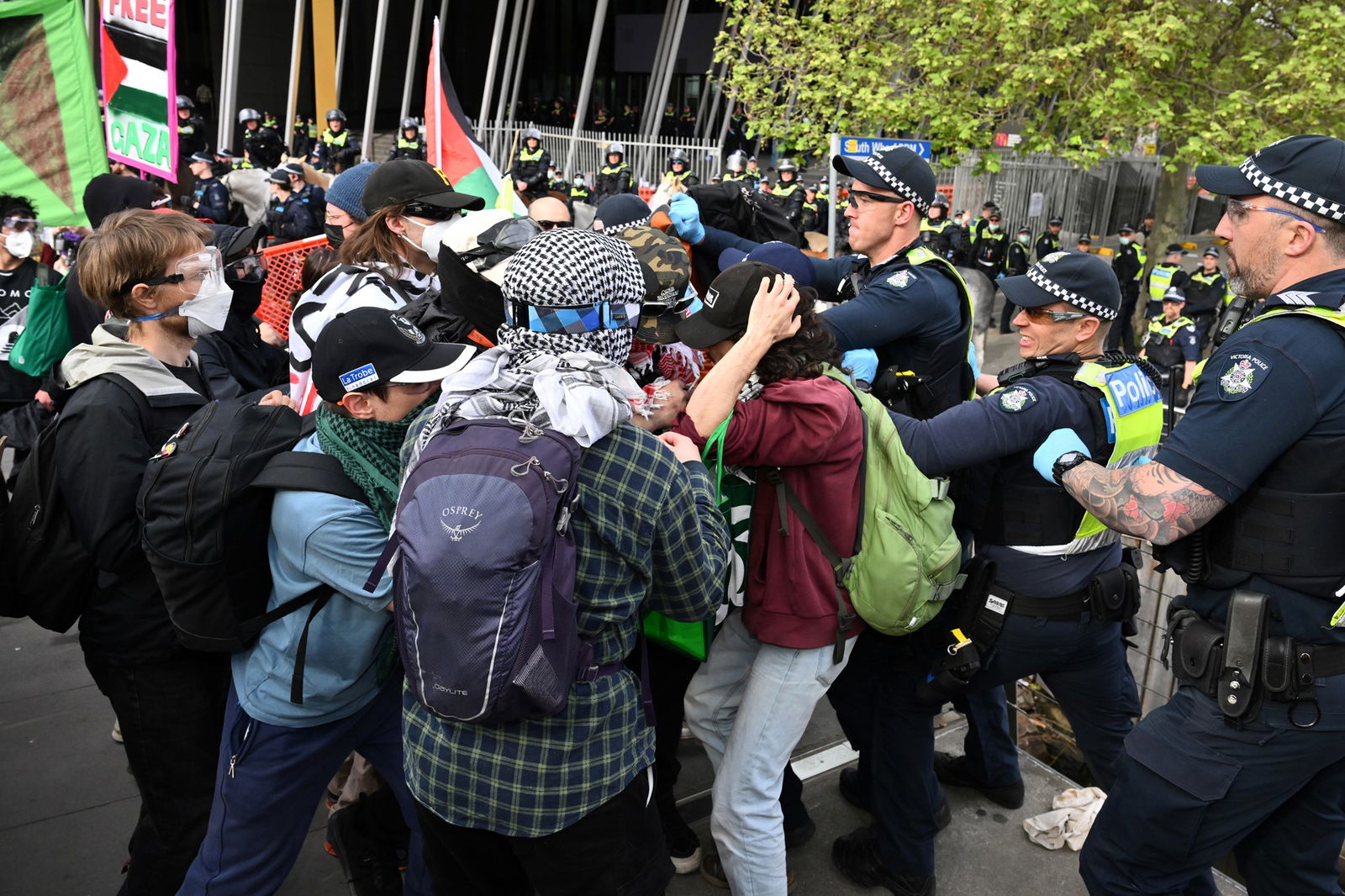 Police clashing with masked protesters