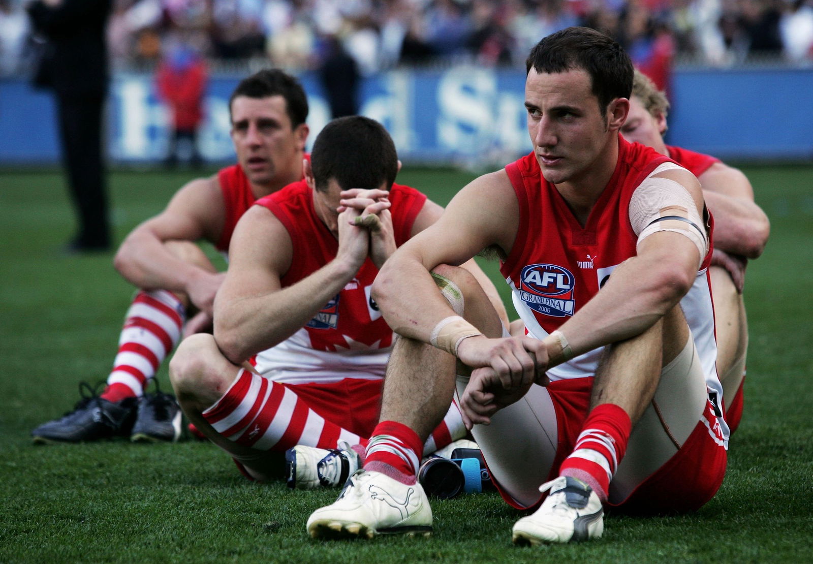 Sydney's Tadhg Kennelly sits on the ground at the MCG after the 2006 AFL grand final