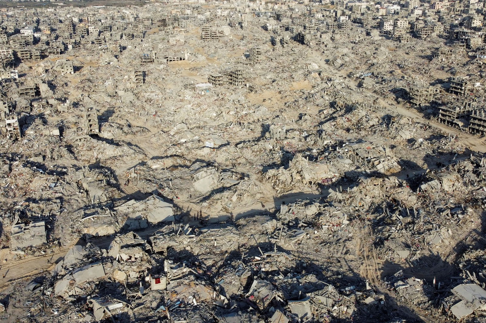 A drone shot of destroyed buildings. 