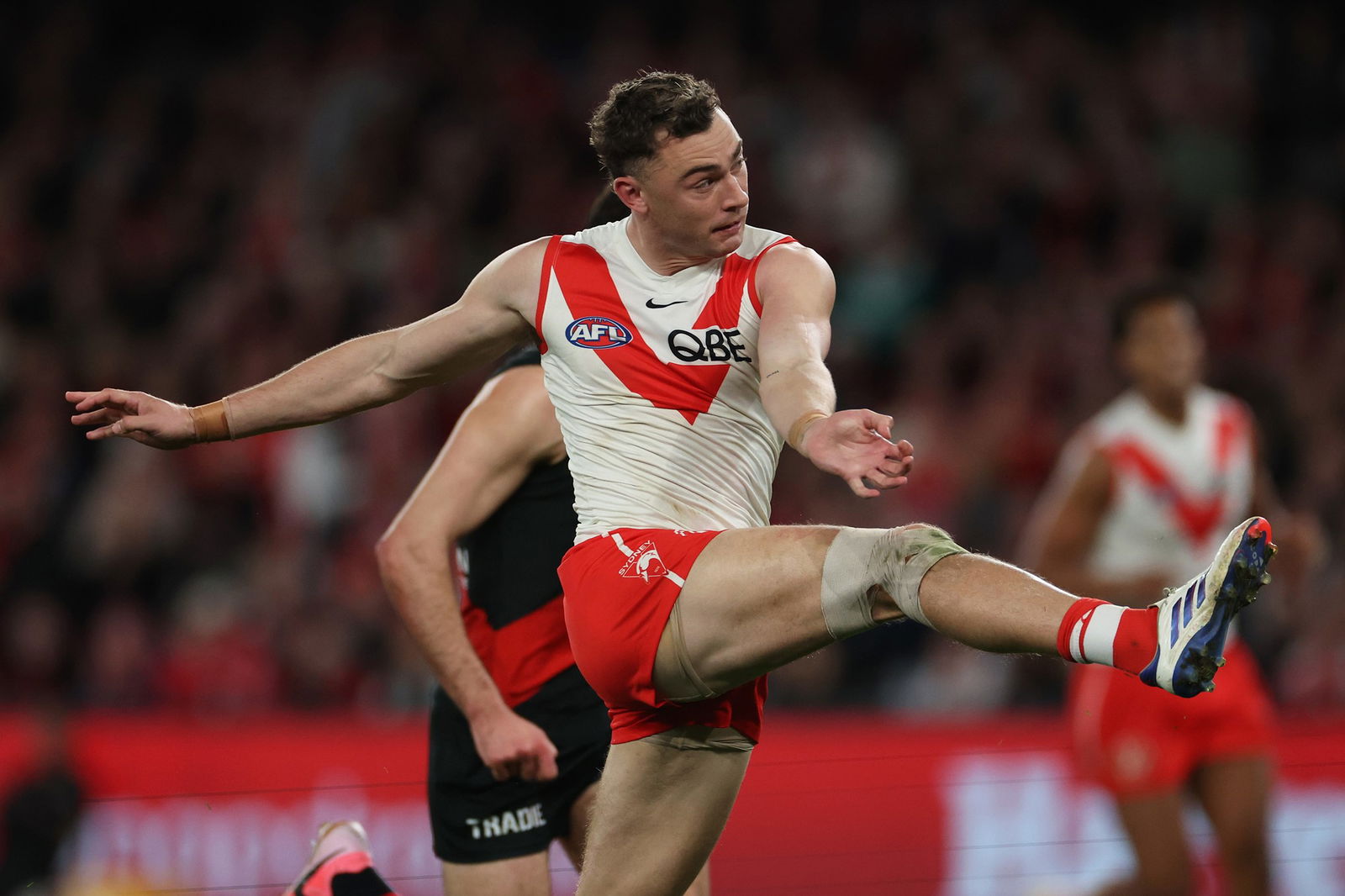 Will Hayward kicks a goal for Sydney against Essendon.