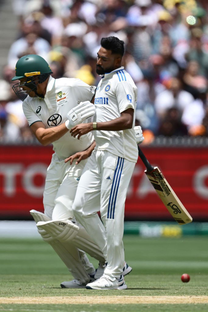 Scott Boland collides with Mohammed Siraj during a cricket Test.