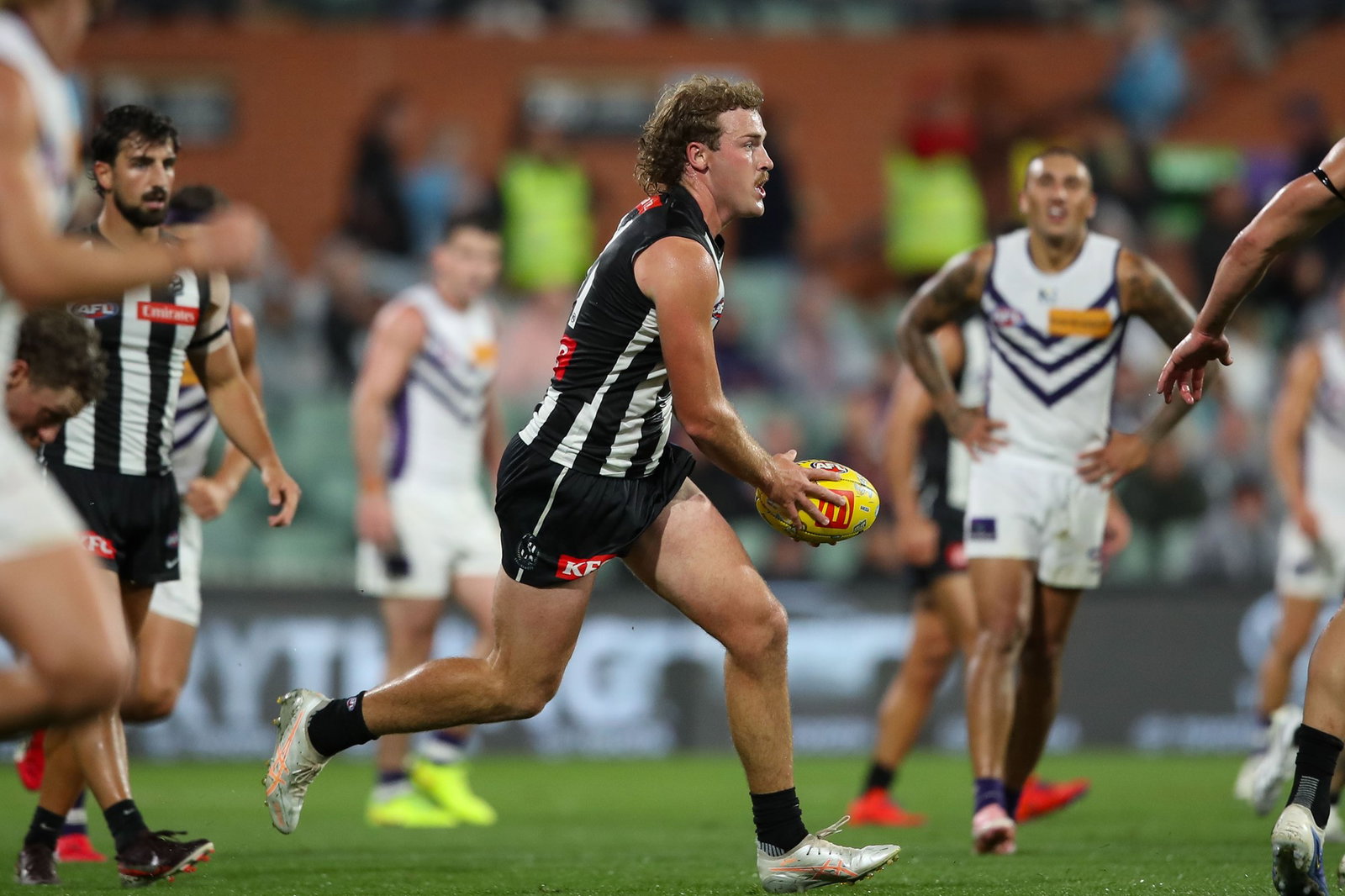 Angus Anderson runs with the ball for the Magpies.