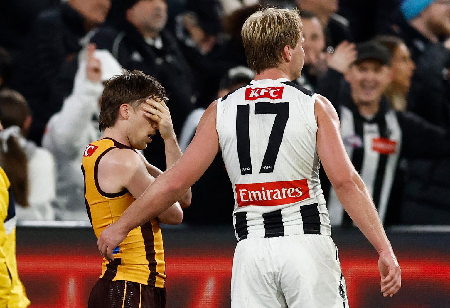 Dylan Moore is consoled by Billy Frampton after failing to make the distance after the siren.