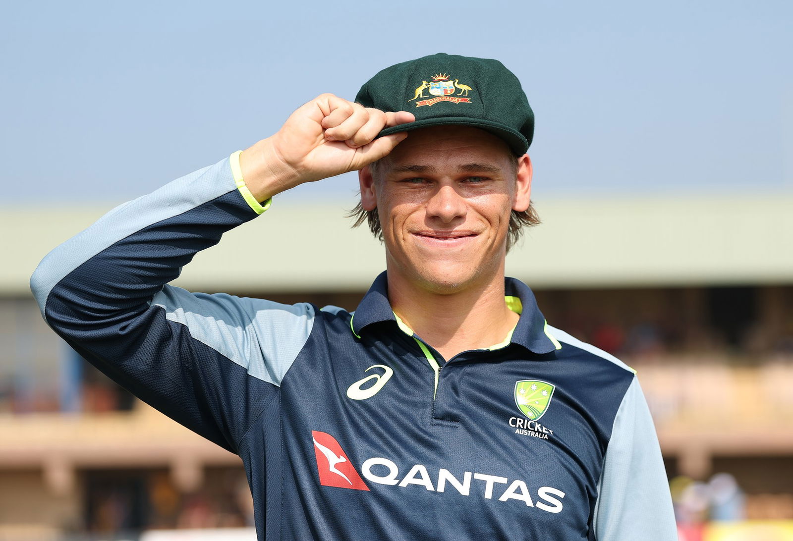 Cooper Connolly smiles in his baggy  green