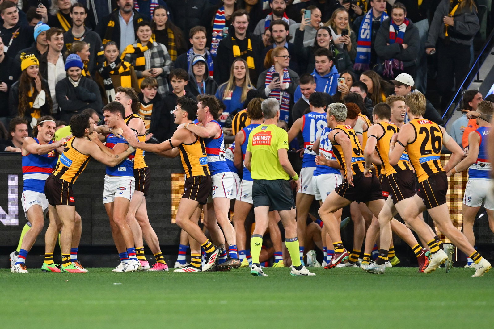 Hawks and Bulldogs players were involved in a scuffle after the quarter-time siren at the MCG.