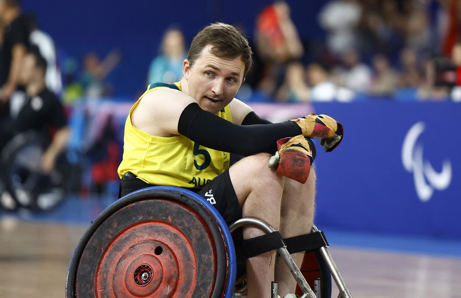 Live: Aussies Ayers and Altschwager win historic para rowing gold in Paris 3 Australian wheelchair rugby player James McQuillan looks upset and has his hands crossed over his knees.