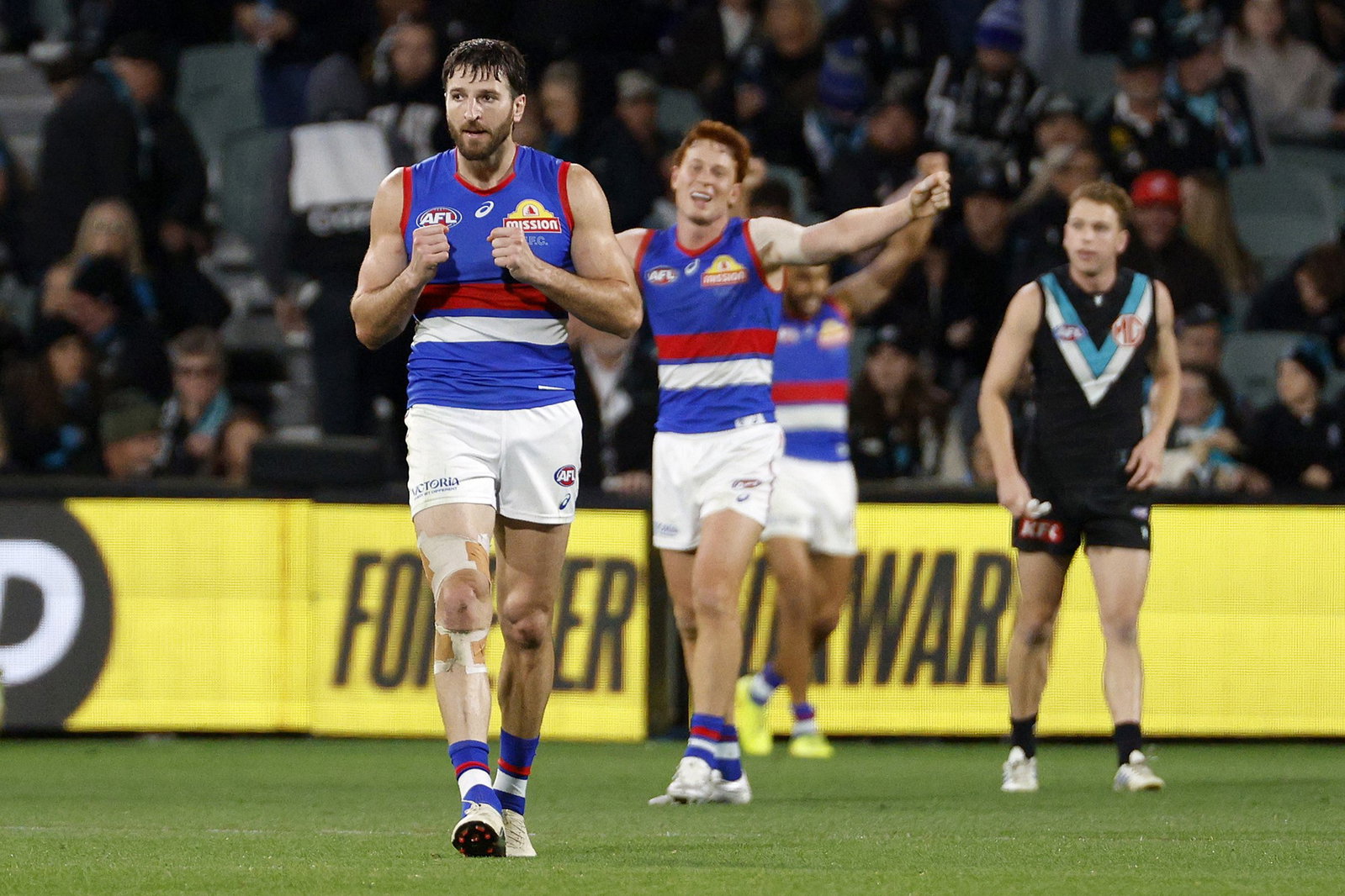 Bulldogs captain Marcus Bontempelli (left) was typically outstanding in the two-point win over Port Adelaide.