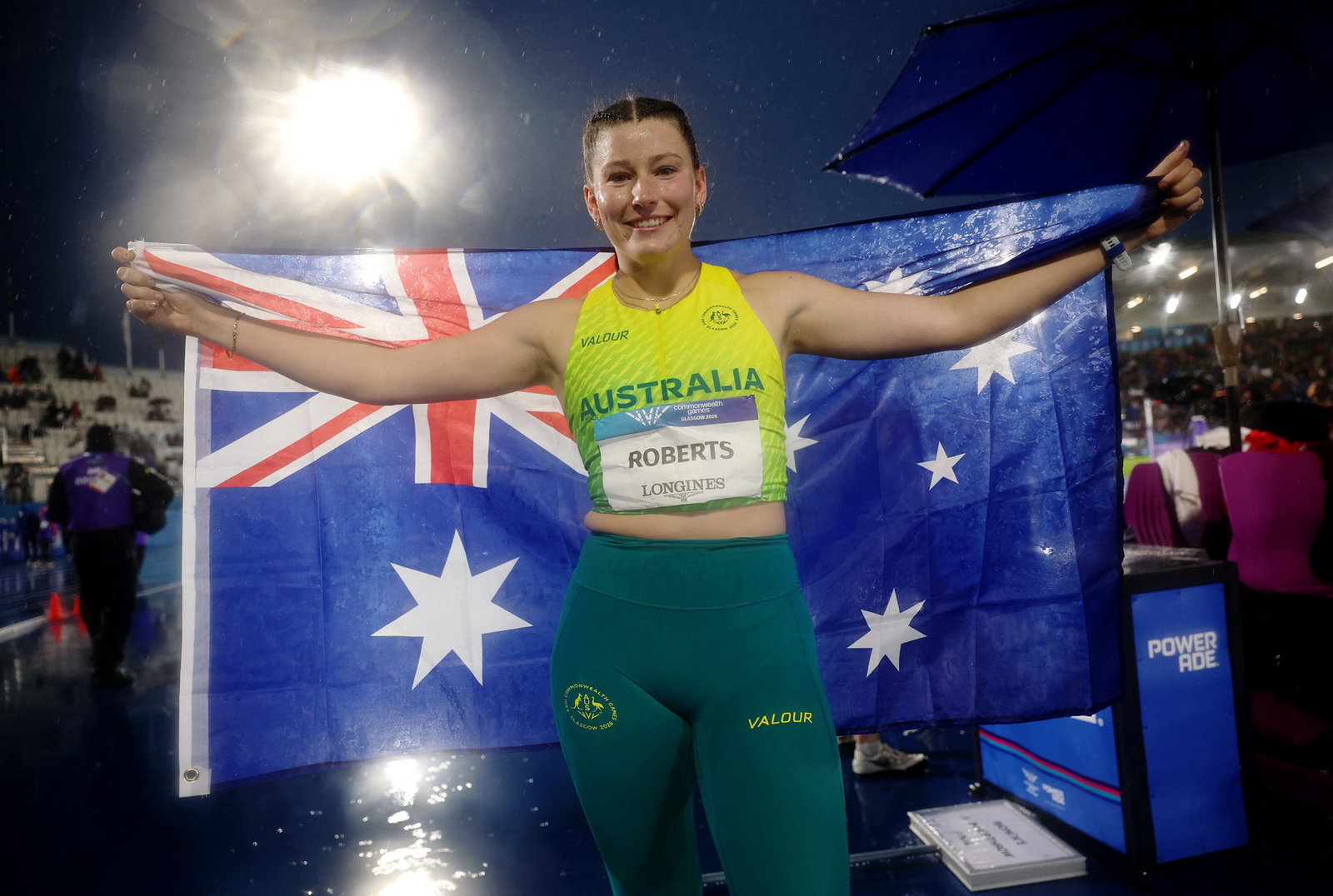 Lara Roberts holds the Australian flag.