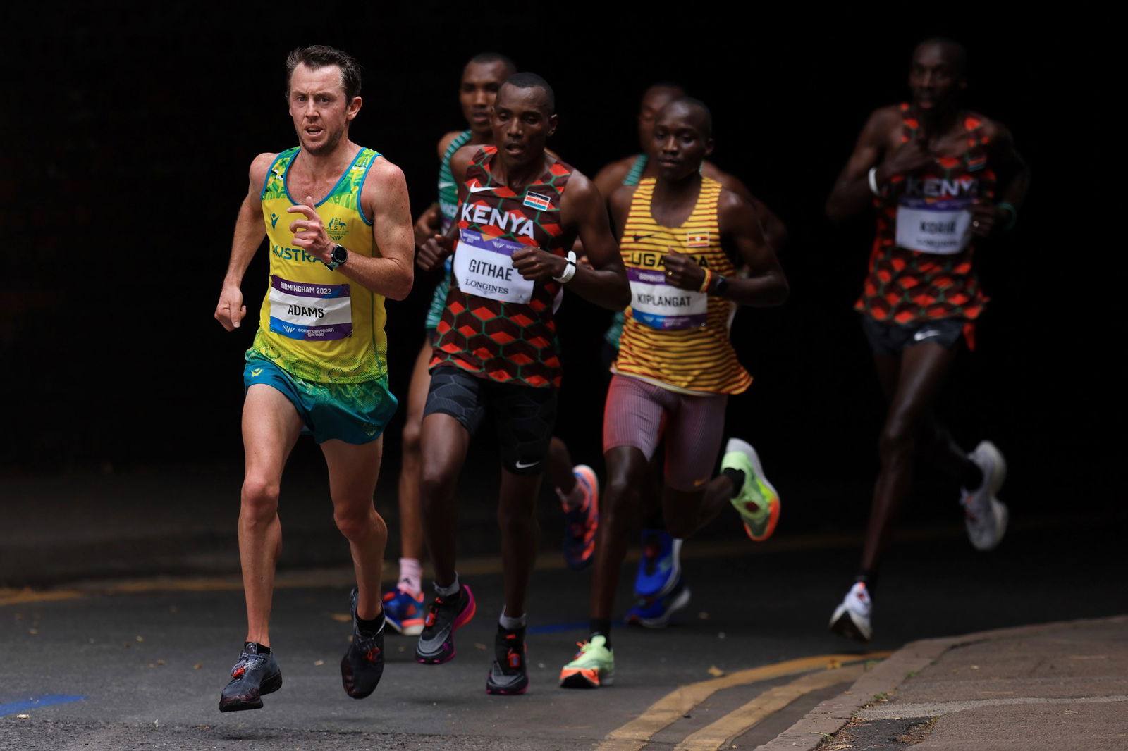 Liam Adams running in front of the pack in the marathon at the Commonwealth Games.