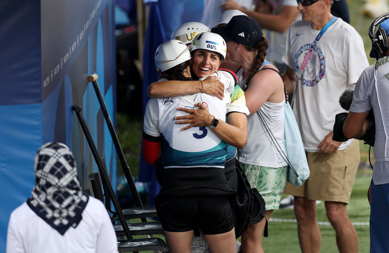 Jess Fox hugs a competitor after the C1 canoe slalom final.